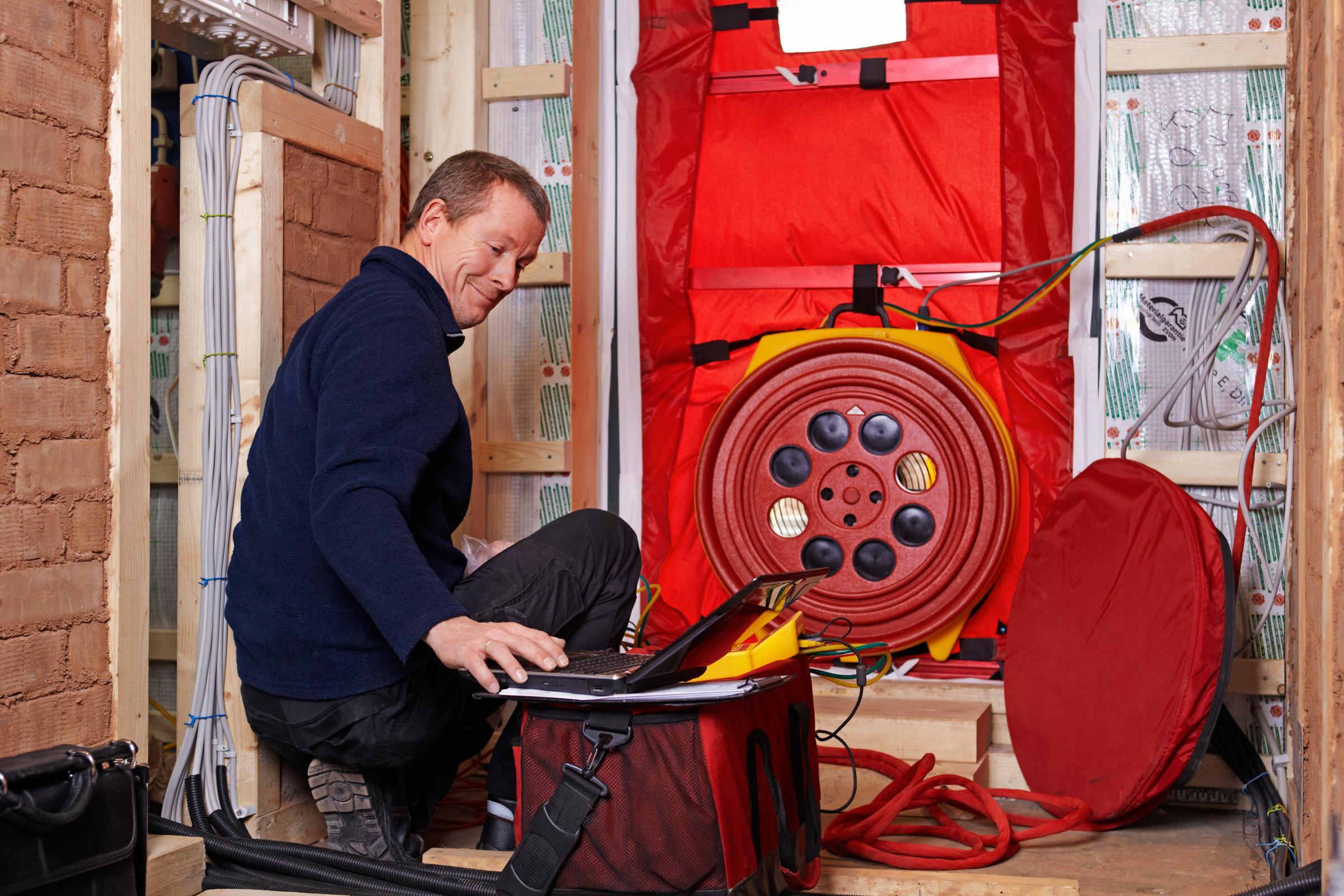 Man doing Blower Door Test 